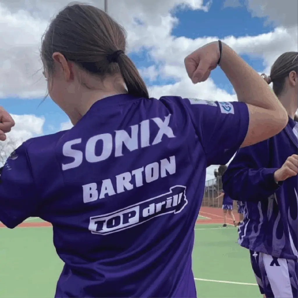 Sonix Netball team jersey with Topdrill branding