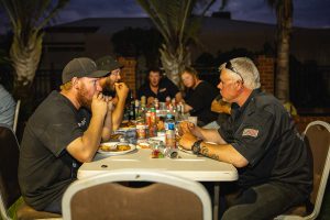 Candid image of two Topdrill team members enjoying conversation at the Christmas party
