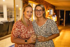 two team members posing for a heartfelt photo at the Topdrill Christmas party celebration